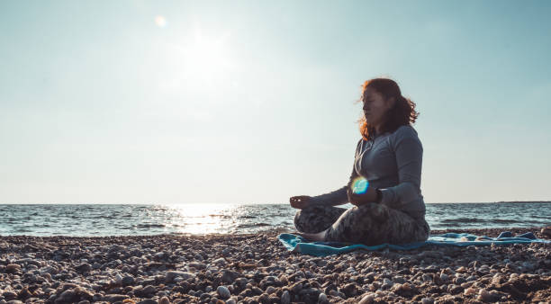 istock girl doing yoga 1133769387