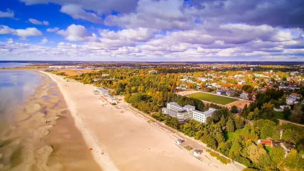 Aerial view of the beautiful seaside city of Parnu. Seen also the clouds from the sky and the coastal beach in the side