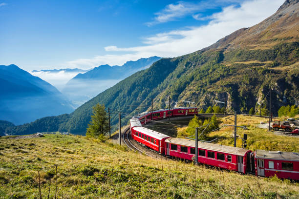 Graubünden, Switzerland. By train from the Alp Grüm through the Puschlav to Tirano, Italy stock photo