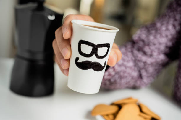 istock man with cup of coffee with a man face 1133771752