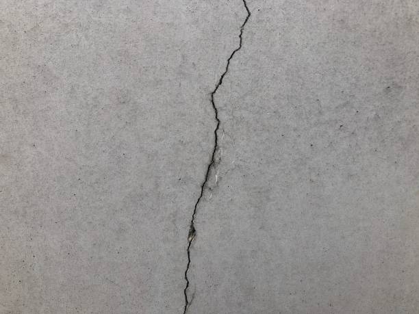 Crack on the wall Vertical Crack on the wall east berlin photos stock pictures, royalty-free photos & images