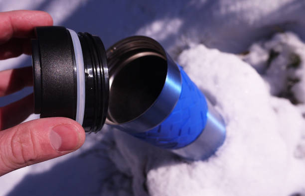 istock Tea (water) flows out of insulated cups (bottles) 1133776679