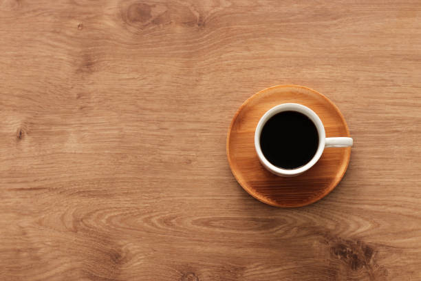 istock coffee cup over wooden table . top view 1133778250