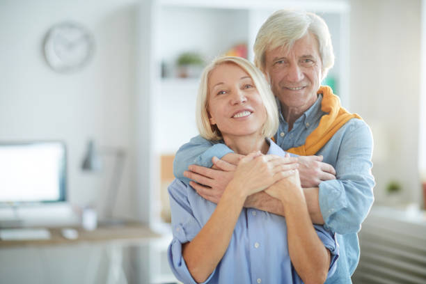 istock Mature Couple Embracing at Home 1133779192