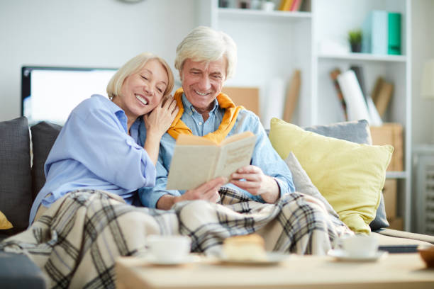 istock Happy Mature Couple Reading Book 1133779205