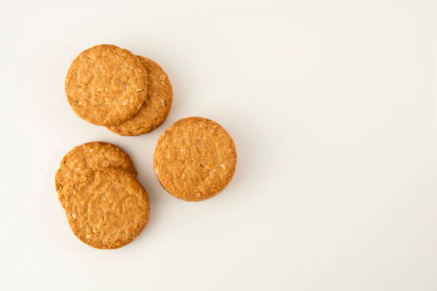 Oatmeal cookie isolated on white. Healthy round cookies. Oatmeal cookie isolated on white. Top view. oat wheat oatmeal cereal plant stock pictures, royalty-free photos & images