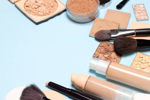 istock Makeup products for creating the perfect skin tone: concealer, primer, liquid foundation fluid with correcting, bronzing, golden shimmer, highlighting make-up powder 1133781314