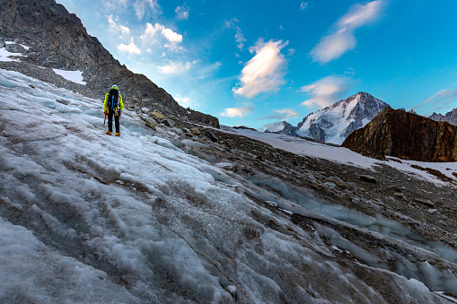 Mountaineer alpinist sportsman back view ice climbing Aiguille du Tour glacier beautiful  landscape view, Mont Blanc mountains massif range, french alps alpinism travel, Europe nature tourism destination.