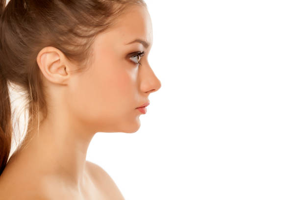 profile of young girl with makeup on white background