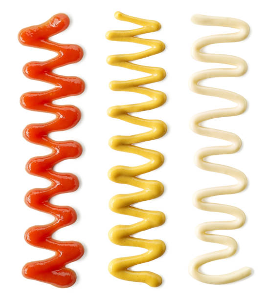 Drizzle of tomato ketchup, mayonnaise and mustard Drizzle of tomato ketchup, mayonnaise and mustard isolated on white background, top view. Set of different sauces ketchup-splash stock pictures, royalty-free photos & images