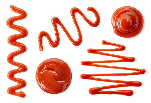 Set of various tomato sauce or ketchup splashes isolated on white background. Top view