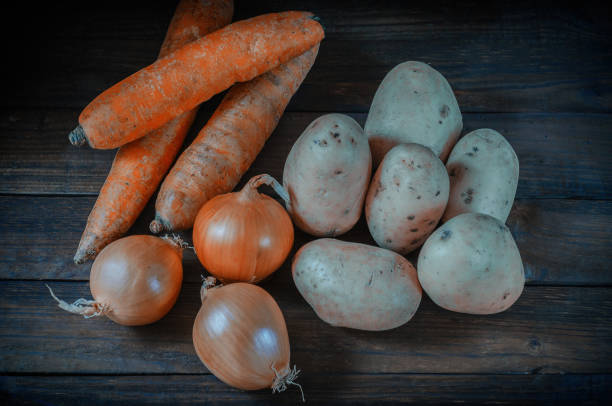 istock Fresh vegetables neatly laid out on a wooden surface. 1133783736
