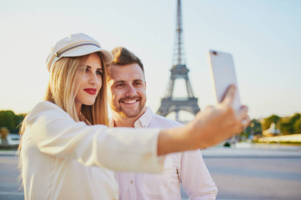 istock Romantic couple taking selfie near the Eiffel tower 1133783895