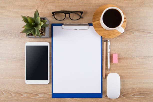 istock Office Desk with Fresh Coffee and Office Supplies 1133786483