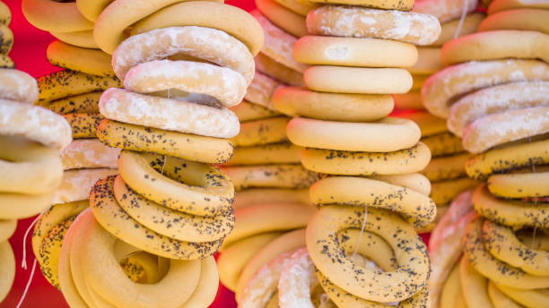istock Lots of bread rolls hanging on the display 1133787372