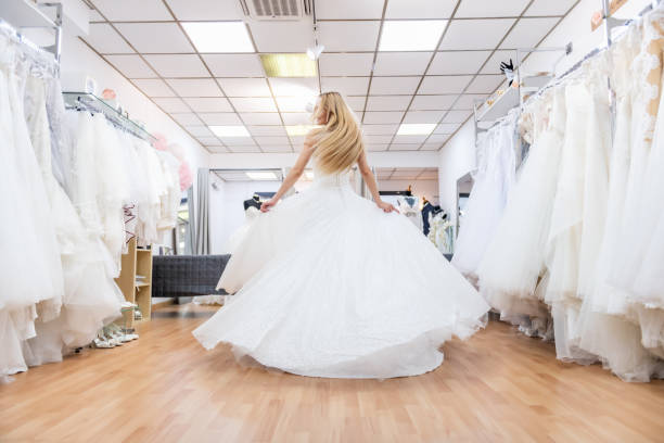 istock Carefree bride dancing in bridal shop 1133787516