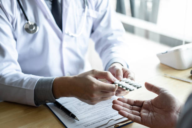 istock Doctor consulting with patient examining for using medicine, presenting results symptom about the problem and recommend treatment method, Healthcare and medical concept 1133788331