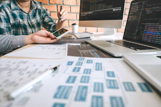 istock Team of Professional Developer programmer cooperation meeting and brainstorming and programming in website working a software and coding technology, writing codes and database 1133788421