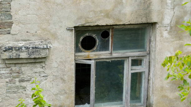 istock The big holes on the window glass 1133790450