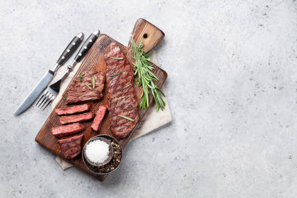 Top blade or denver steak Top blade or denver grilled steak over cutting board. Top view with copy space blade roast stock pictures, royalty-free photos & images