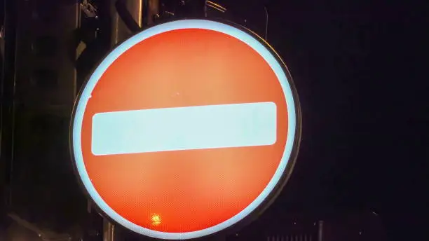 Photo of A horizontal sign on a big round sign