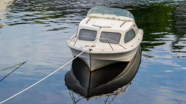 istock The white small boat floating on the river 1133794312