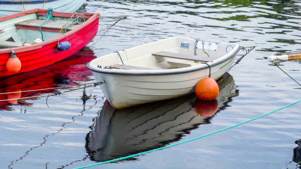 istock Two small boats floating on the river 1133794328