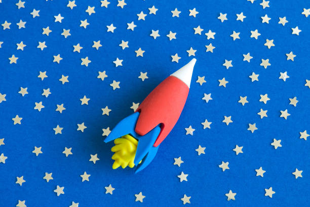 istock Flat lay of rocket toy in space with stars abstract. 1133795567