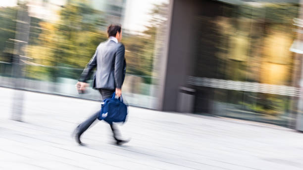 istock Businessman walking outdoors 1133798447