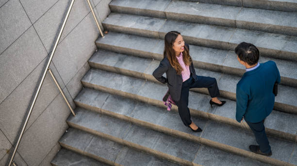 istock Business people discussing on stairs 1133798471