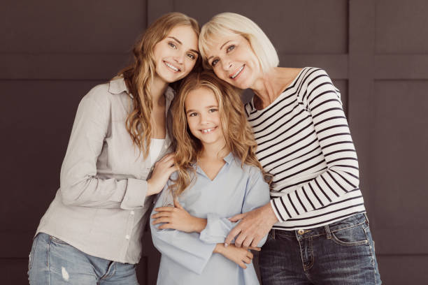 istock Women generation: granny, mom and daughter against wall 1133798696