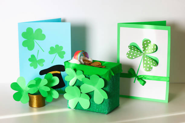istock Diy St Patricks Day greeting card made cardboard and paper clovers gray background. Gift idea, decor 1133798907