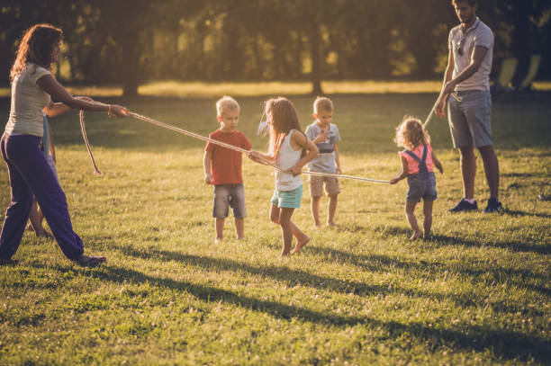 istock Group of children playing in public park 1133802293