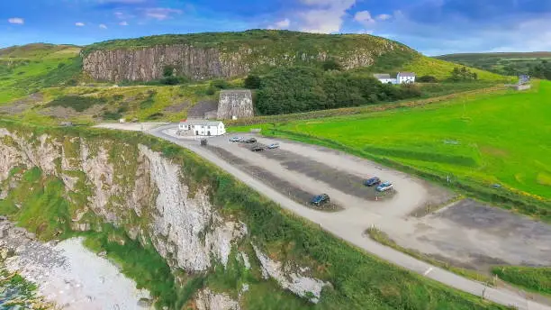 Closer look of the parking lot in the cliff where tourists visiting Carrick-a-Rede parked their cars in Ireland