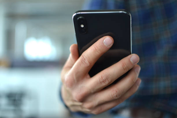 istock A hand is holding a smartphone 1133805292