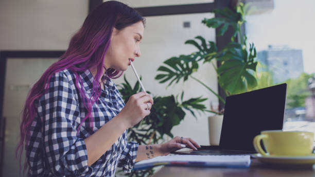 istock Woman typing on notebook with blank screen with copy space for y 1133807784