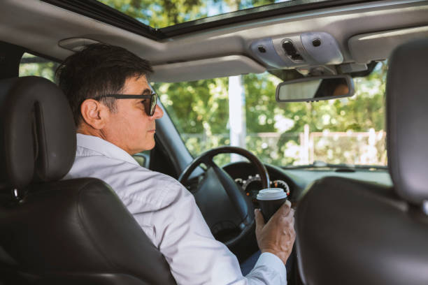 istock Businessman driving a car 1133807994
