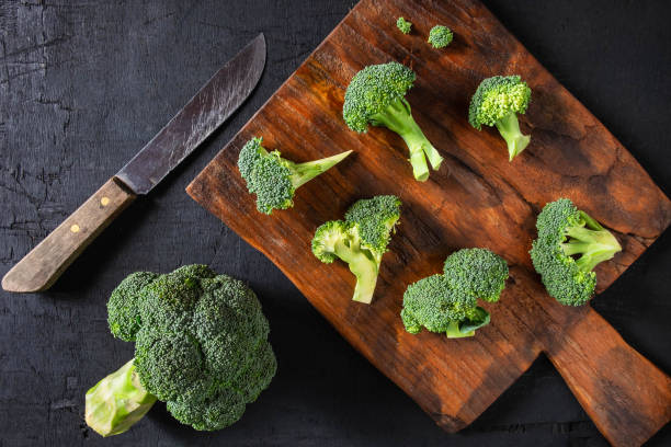 istock Fresh Broccoli on a Wooden Chopping Board 1133808023