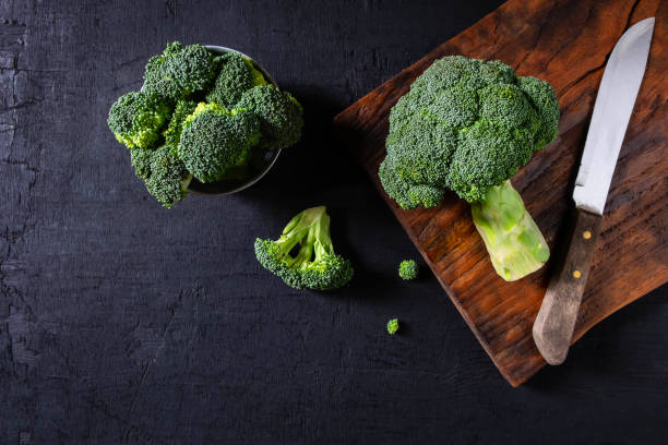istock Broccoli raw fresh on wooden background. 1133808067