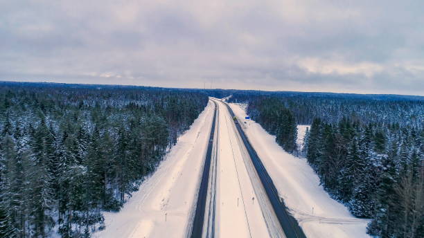 istock The long road with thick snow on the road side 1133808487