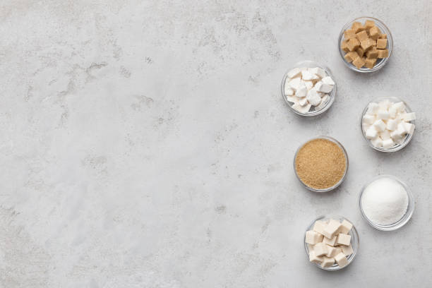 istock Collection of different kinds of sugar on gray background 1133810285