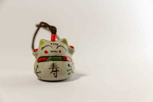 Photo of Maneki Neko - Japanese welcoming cat - with clipping path