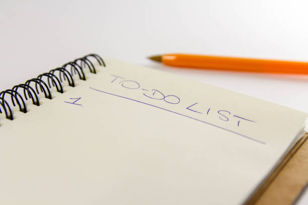 istock To do list in spiral notepad. White background, flat lay style. 1133811440