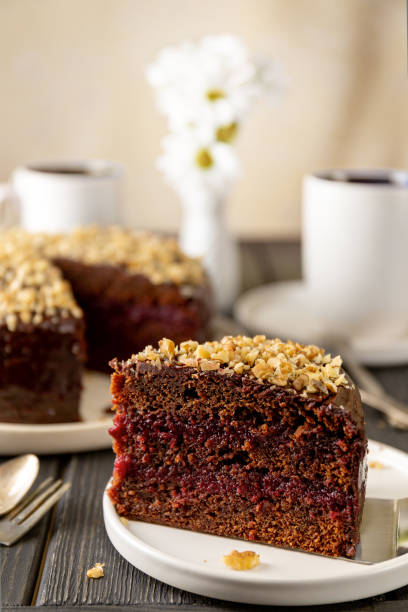 istock Slices of homemade chocolate cake with walnuts 1133813043