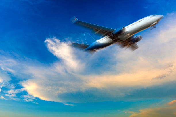 istock Passenger airliner taking off in cloud landscape at sunset 1133815752