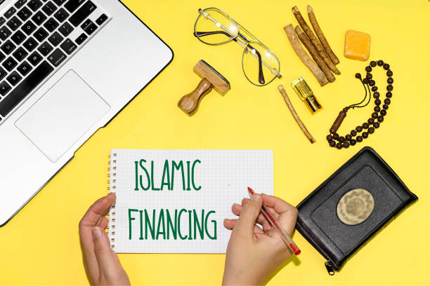 text-schild zeigt islamische finanzierung auf notebook - sharia stock-fotos und bilder
