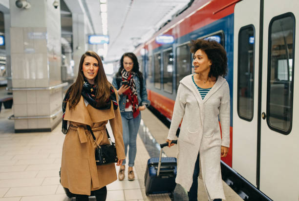 istock Three friends with suitcases travel together 1133818930