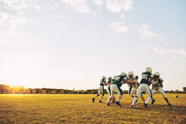 istock American football team doing defensive drills during a practice session 1133819116