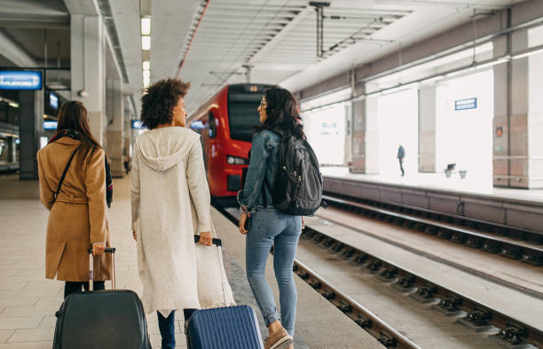 istock Three friends with suitcases travel together 1133819396
