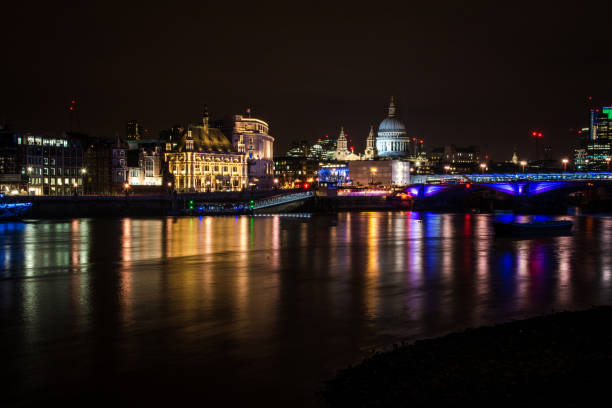 istock London's skyline and Thames river at night 1133820344
